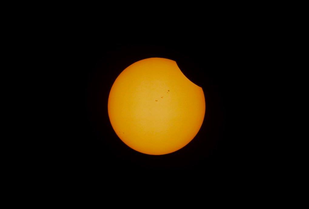 Partial eclipse, sunspots